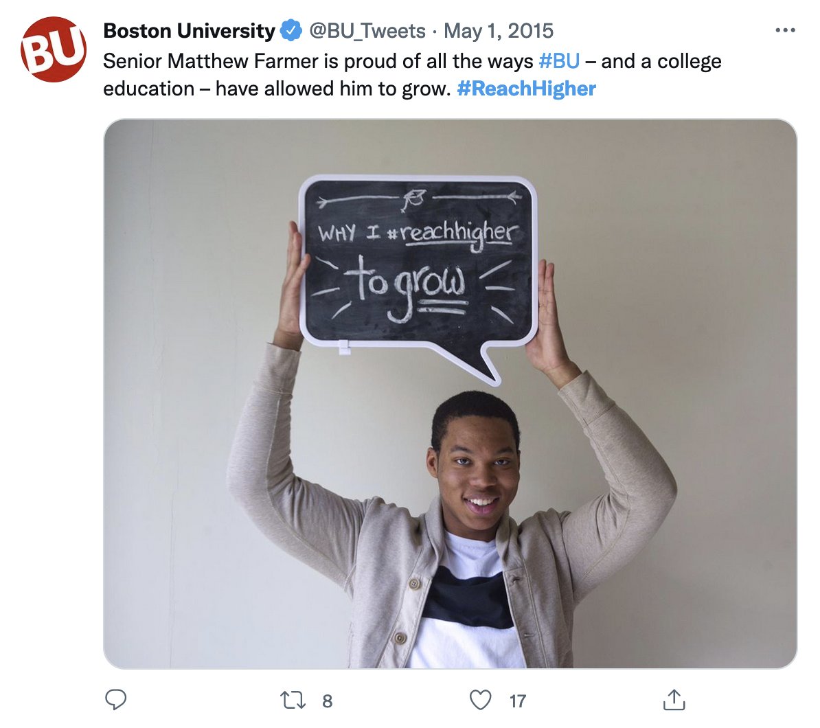 A picture of a tweet with a custom photo. In it, a black man holds a speech bubble shaped chalkboard reading &ldquo;Why I reach higher: to grow&rdquo;.